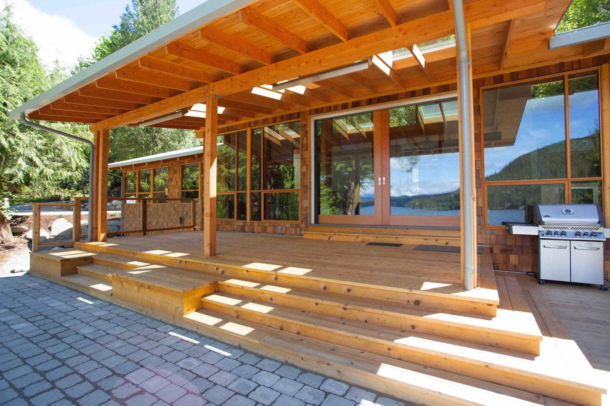 outside deck view of bc built timber frame log home.