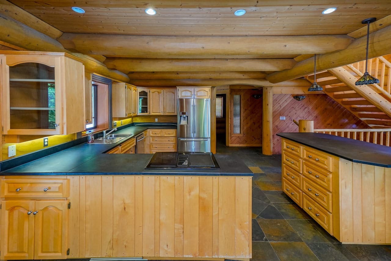 Kicthen of BC Home Builders Custom Full Scribe Log Home.