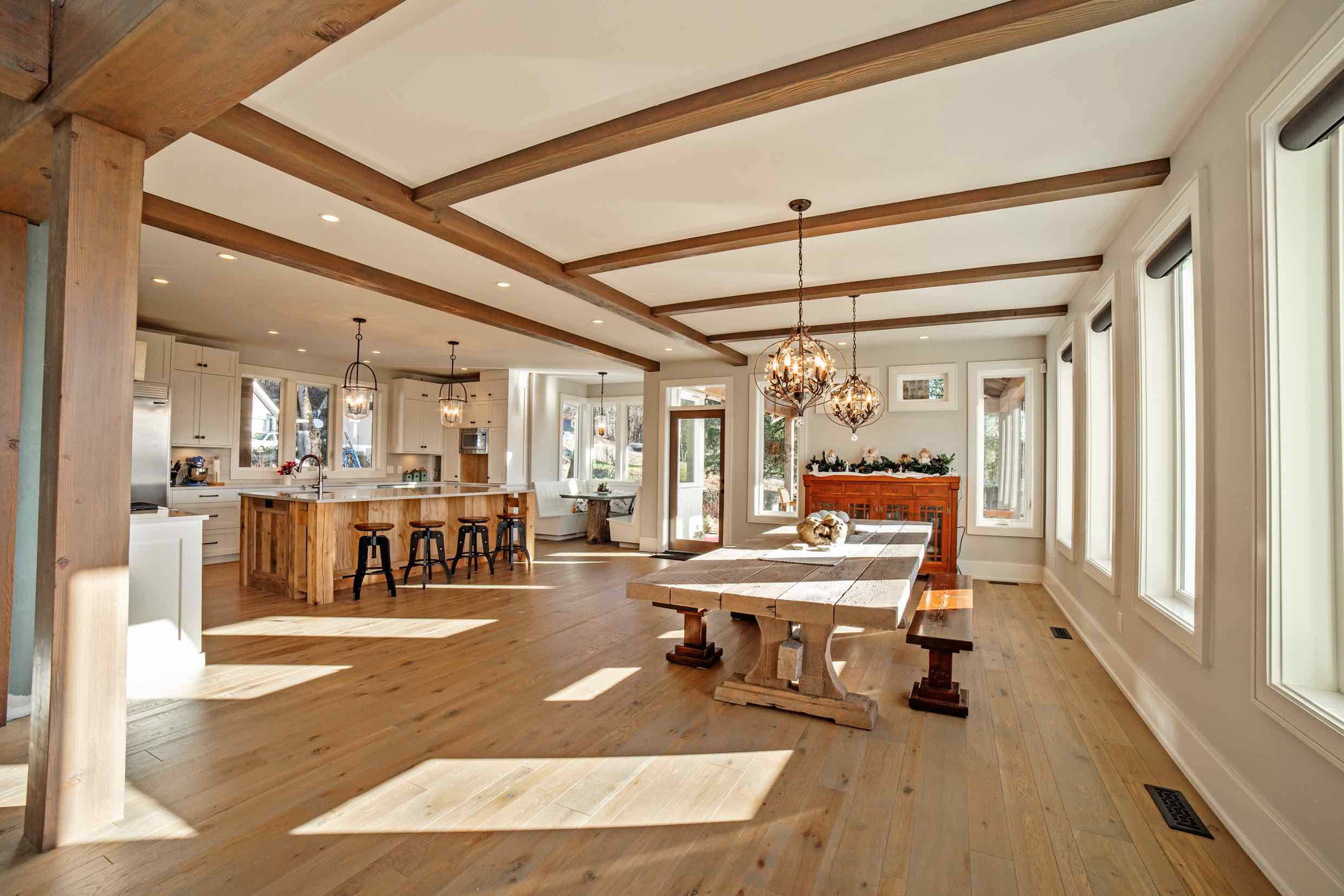 Dinning room and kitchen in Custom Built Timber Frame Log Home.