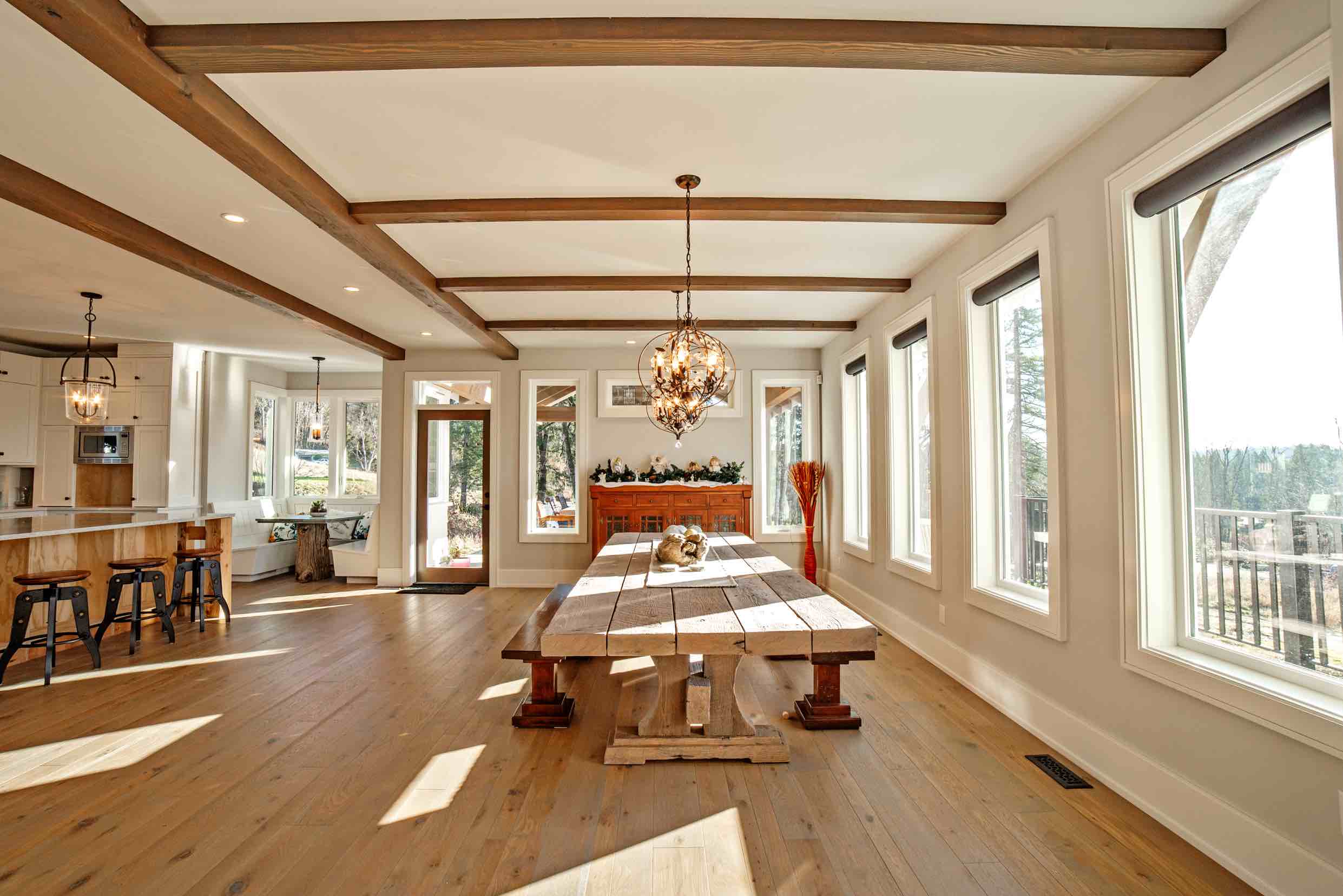 Kitchen and dinning room area view of Timber Frame Home.