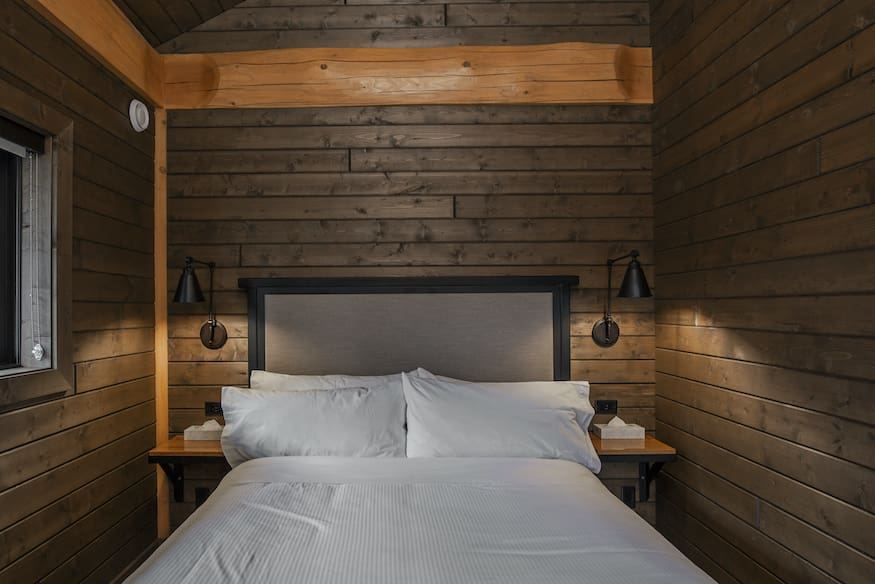 Bedroom in custom built twin eagle log cabin kits