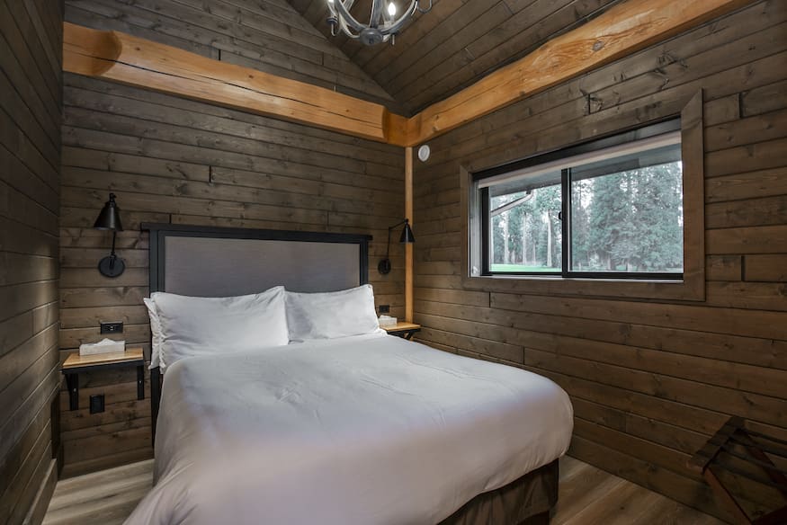 Bedroom in custom built twin eagle log cabin kits