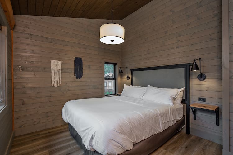 interior bedroom view in custom built log cabin kit.