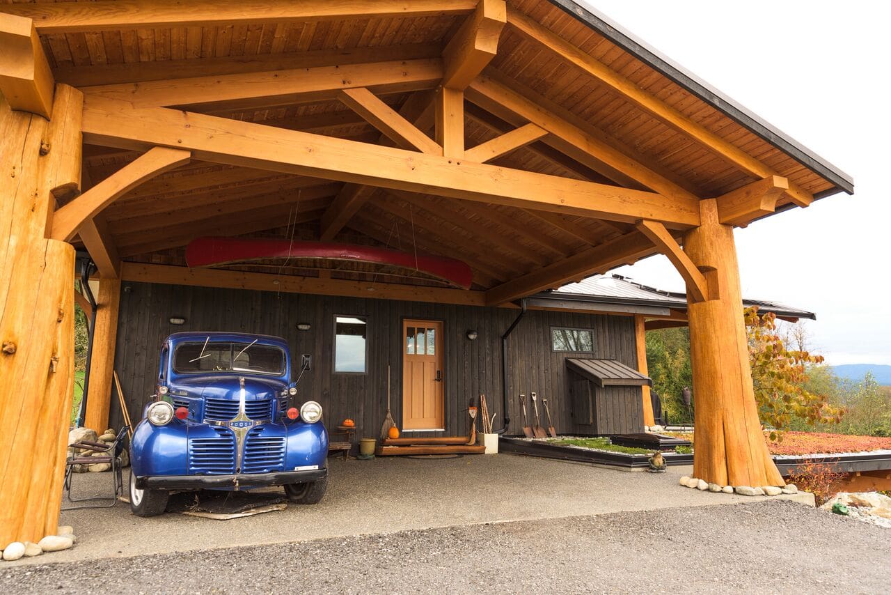 Garage View of Timber Frame Log home by BC Log Home Builders.