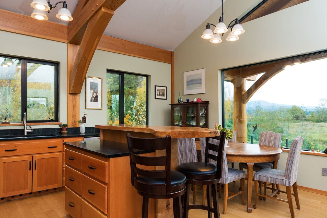 Kitchen in Timber Frame Log home by BC Log Home Builders.