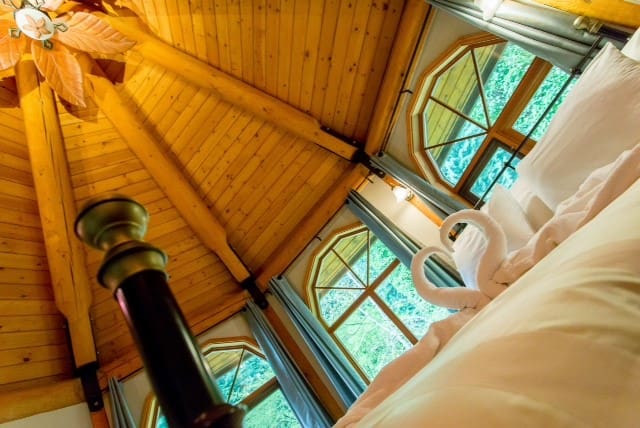 Bedroom of BC Log Home Builders Log Home.