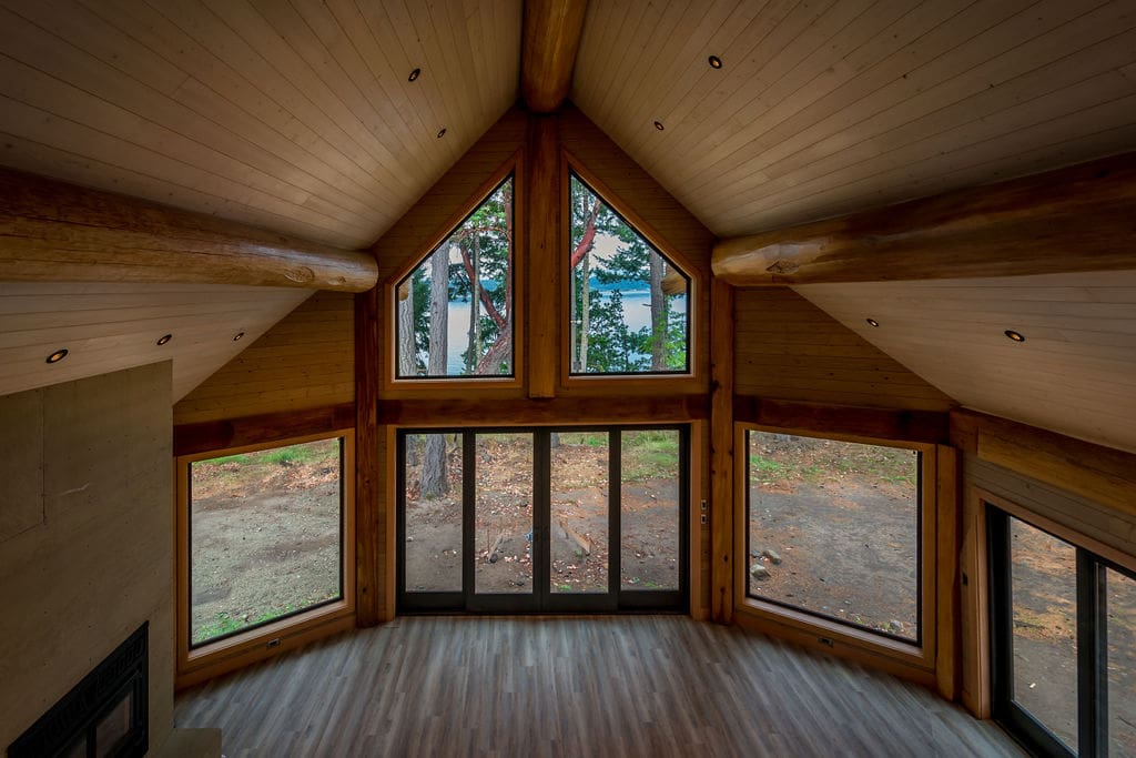 log beam in custom built log cabin living area.